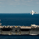 Illustration for article titled Cool Photo of a F-18 Flyby of an Aircraft Carrier